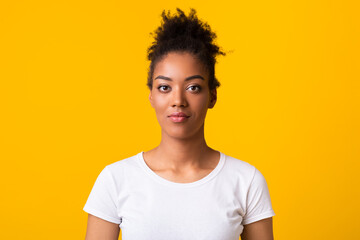 Close up portrait of afro woman looking at camera