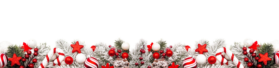 Long Christmas border of red and white ornaments and frosty branches isolated on a white background