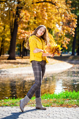 Happy little girl in an autumn park