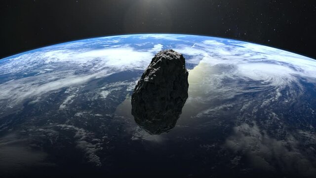 An asteroid falls to Earth. The asteroid spins and flies rapidly towards Earth.