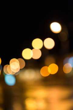 Blurred Night city street colorful lights bokeh background at dark night