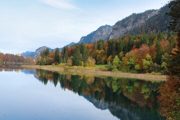 Fototapeta na wymiar A beautiful day in autumn at Alpsee in Bavaria close to Neuschwanstein castle