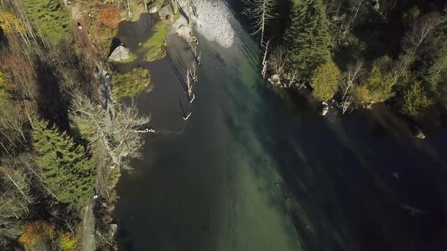 aerial view of small lake and multicolor woods, in autumn season lake in Val di Mello, Val Masino , Italy - lombardy.
