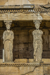 The Erechtheion (or Erechtheum, 406 BC) with Caryatids - ancient Greek temple on the north side of the Acropolis. Erechtheion dedicated to both Athena and Poseidon. Athens, Greece.
