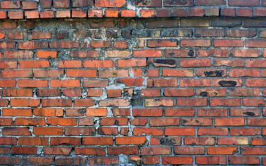 Red brick old wall of a destroyed building. Background.