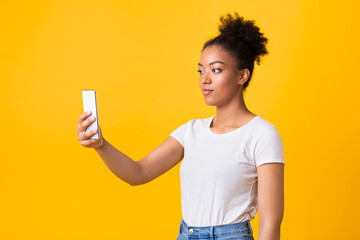 Black woman making video call using mobile phone