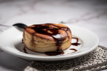 High angle shot of a homemade pie with caramel sauce