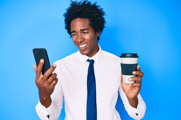 Handsome african american man with afro hair using smartphone and drinking a cup of coffee winking...