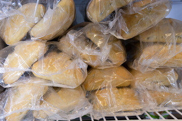 frozen bread in the supermarket refrigerator. Sale of ciabatta, loaf, hamburger buns