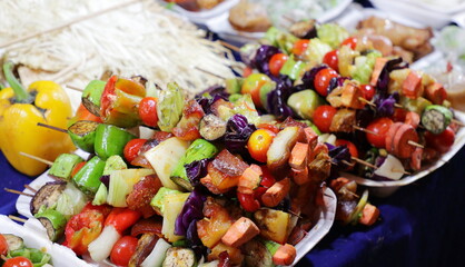 Grilled vegetable and meat skewers sold in an Asian food street market