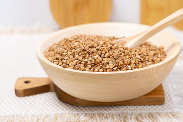 Buckwheat grain dry buckwheat. Close-up of brown buckwheat groats. Healthy food.