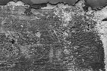 Texture of a concrete wall with cracks and scratches which can be used as a background