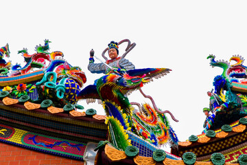 Tainan, Taiwan, October 12, 2019 Colorful roofs of a Taiwanese temple decorated with sculptures of sacred animals, dragons, lions and deities in traditional mosaic art