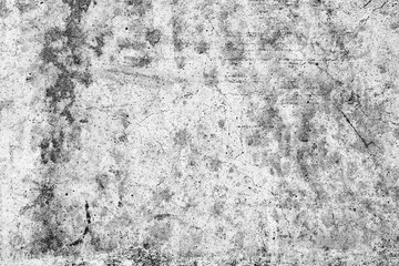 Fototapeta premium Texture of a concrete wall with cracks and scratches which can be used as a background