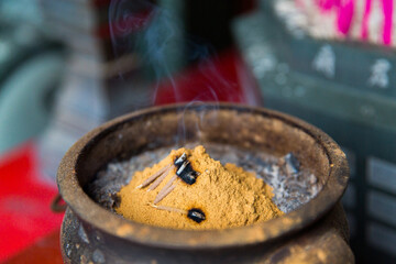 Incense burning Embossed in an incense big stone pot in a buddhistic asian temple in Taiwan