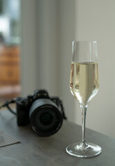 glasses of prosecco wine and camera on the table