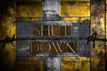 Shut Down text message on vintage textured grunge copper and gold background