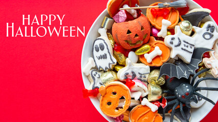 candy bowl of chocolates and sweets, Halloween Jack o Lantern cookies - Trick or Treat Halloween card background