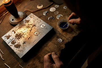 Hand-made silver items with cloisonné enamel in progress. Traditional work in the mountain village...