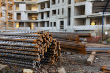powerful iron bars on the background of a house under construction