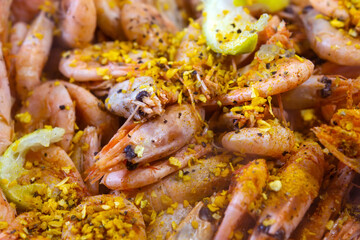 fried shrimp close-up with spices and lemon. selective focus. Sea food