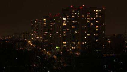 Tower Block by night, showing the diversity of life and lights in apartment blocks.