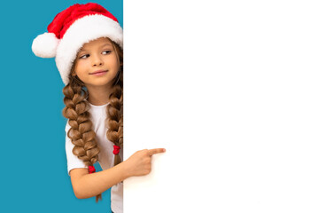 A little girl in a Christmas hat points to your ad.