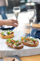 Crostini with Tuna Pate and Fresh Tomatoes. Brunch in Restaurant