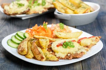 cutlet with pineapple and  baked potatoes with bouquet of salads