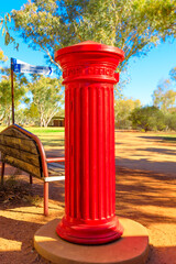 Antique red mailbox of post office of the old telegraph station in Alice Springs. A historic...