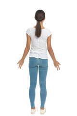 Back view of casual woman being surprised, standing