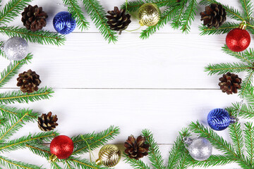 Fototapeta na wymiar Christmas wooden background. Spruce branch and cone. Copy space. Postcard.Christmas tree. Fir branches.Flat lay.
