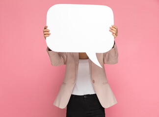 businesswoman hiding behind a speech bubble