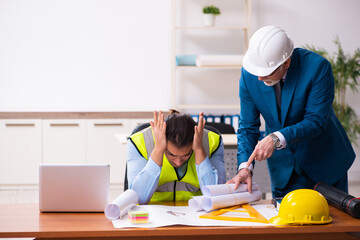 Two male architects working in the office