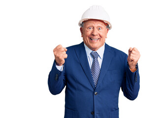 Senior handsome grey-haired man wearing suit and architect hardhat excited for success with arms raised and eyes closed celebrating victory smiling. winner concept.