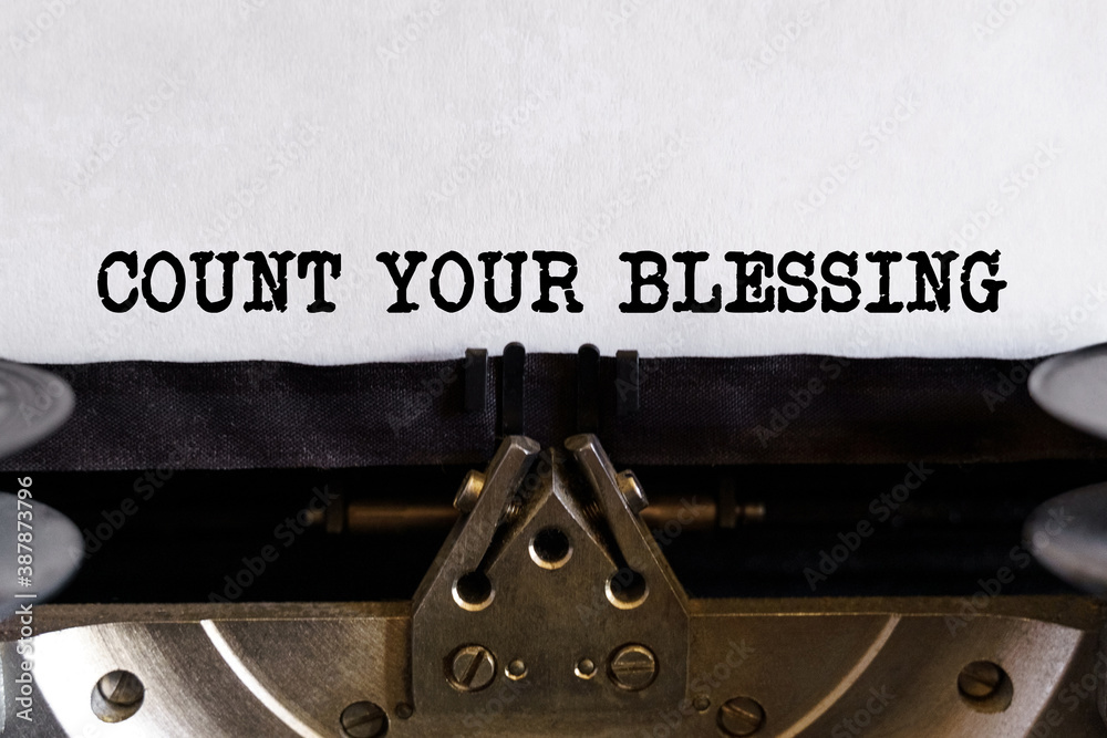Fototapete vintage typewriter with printed text -count your blessing