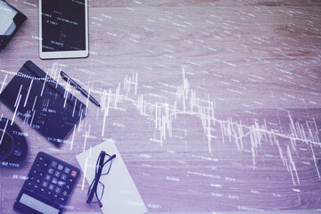 Double exposure of forex graph drawing and work table top veiw. Concept of financial analysis.