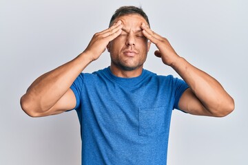 Handsome muscle man wearing casual clothes with hand on head, headache because stress. suffering migraine.