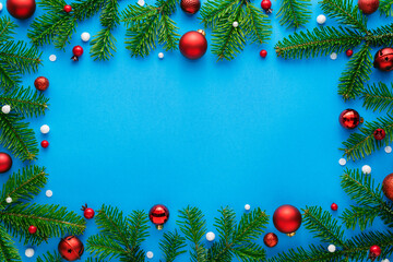 Fototapeta na wymiar Blue christmas background with christmas decorations, top view and copy space for text