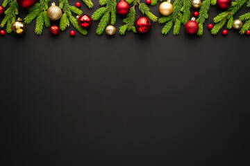 Black christmas or New Year background with ornate frame of christmas tree decorations