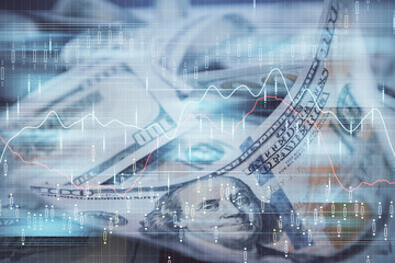 Double exposure of forex graph drawing over us dollars bill background. Concept of financial markets.
