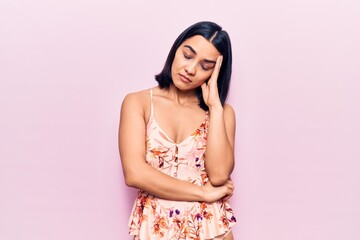 Young beautiful latin woman wearing casual clothes thinking looking tired and bored with depression problems with crossed arms.