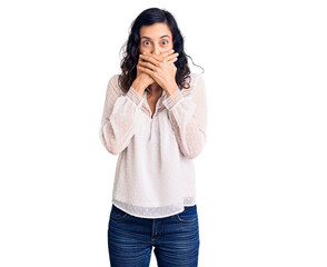 Young beautiful hispanic woman wearing casual clothes shocked covering mouth with hands for mistake. secret concept.