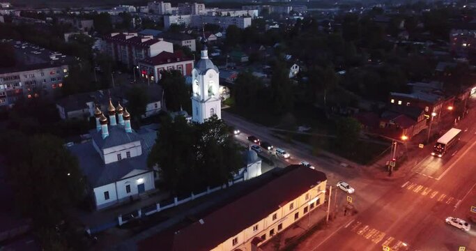 Aerial panoramic view of Pokrov cityscape with Pokrovsky cathedral and lighted trunk road M7 at night, Russia