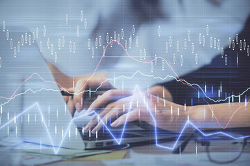 Plakat Multi exposure of woman hands typing on computer and financial graph hologram drawing. Stock market analysis concept.