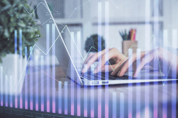 Double exposure of woman hands typing on computer and forex chart hologram drawing. Stock market invest concept.