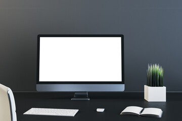 Contemporary business desk with blank computer screen