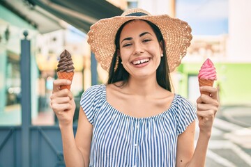 Young latin tourist girl on vacation smiling happy eating ice cream at the city.