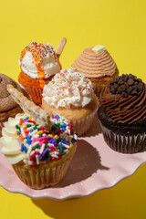 Cupcakes on Cake  Stand on Yellow Table