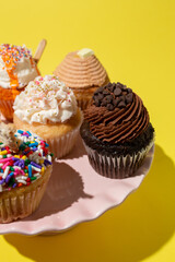 Cupcakes on Cake  Stand on Yellow Table